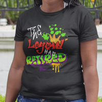 Black t-shirt featuring bold graffiti style fonts states "The Legend Has Retired"