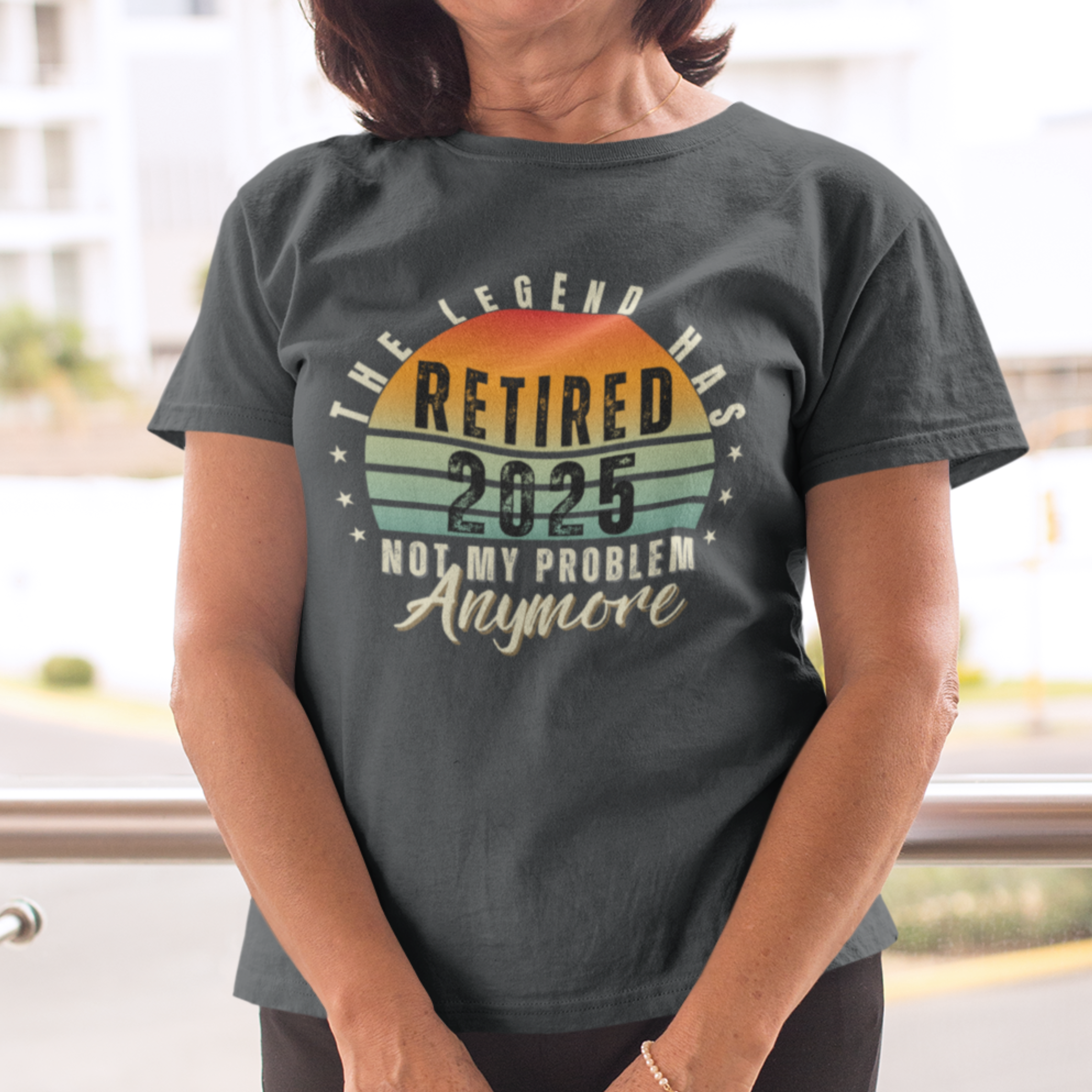 Black t-shirt featuring a striped sunset that reads The Legend Has Retired Not My Problem Anymore