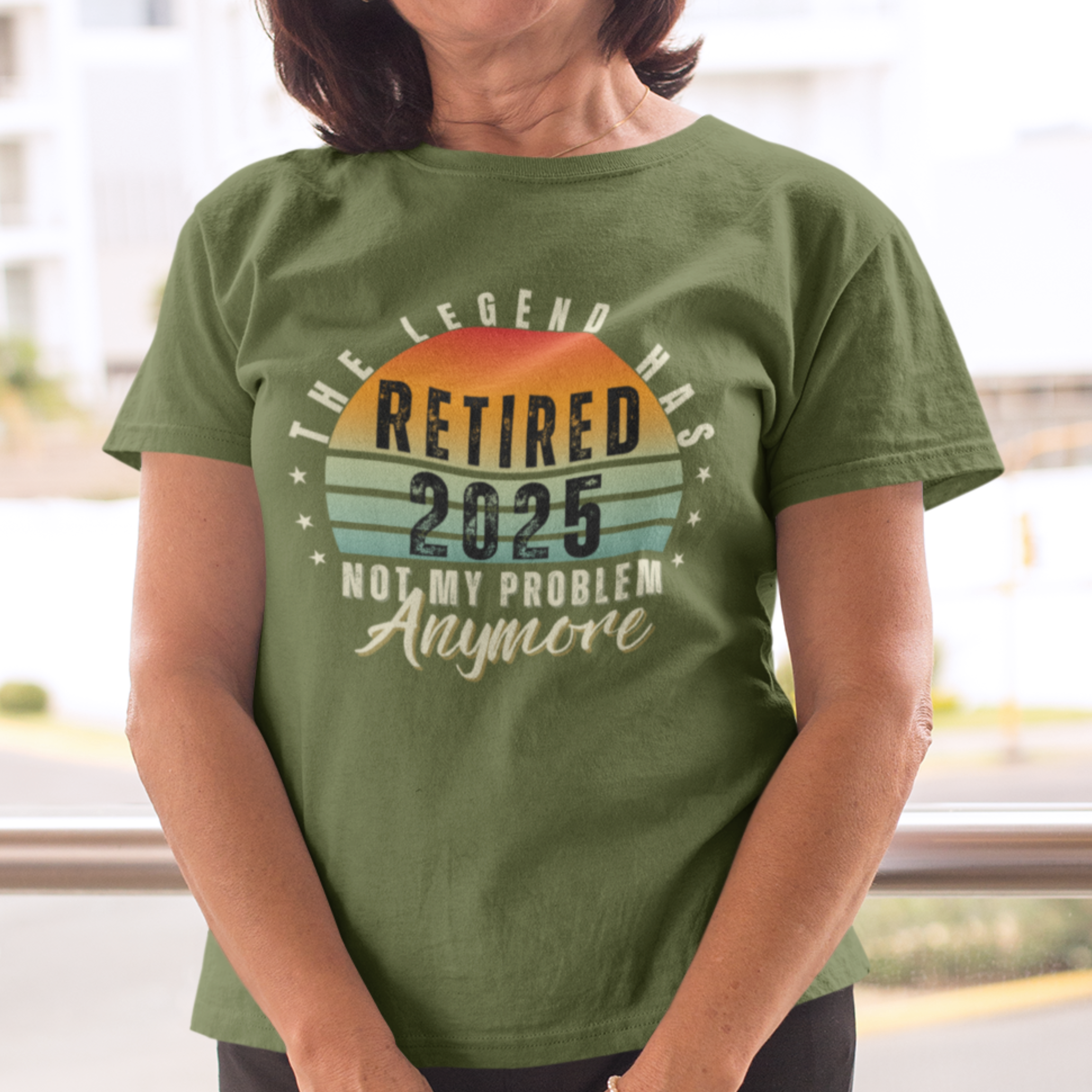 Military green t-shirt featuring a striped sunset that reads The Legend Has Retired Not My Problem Anymore