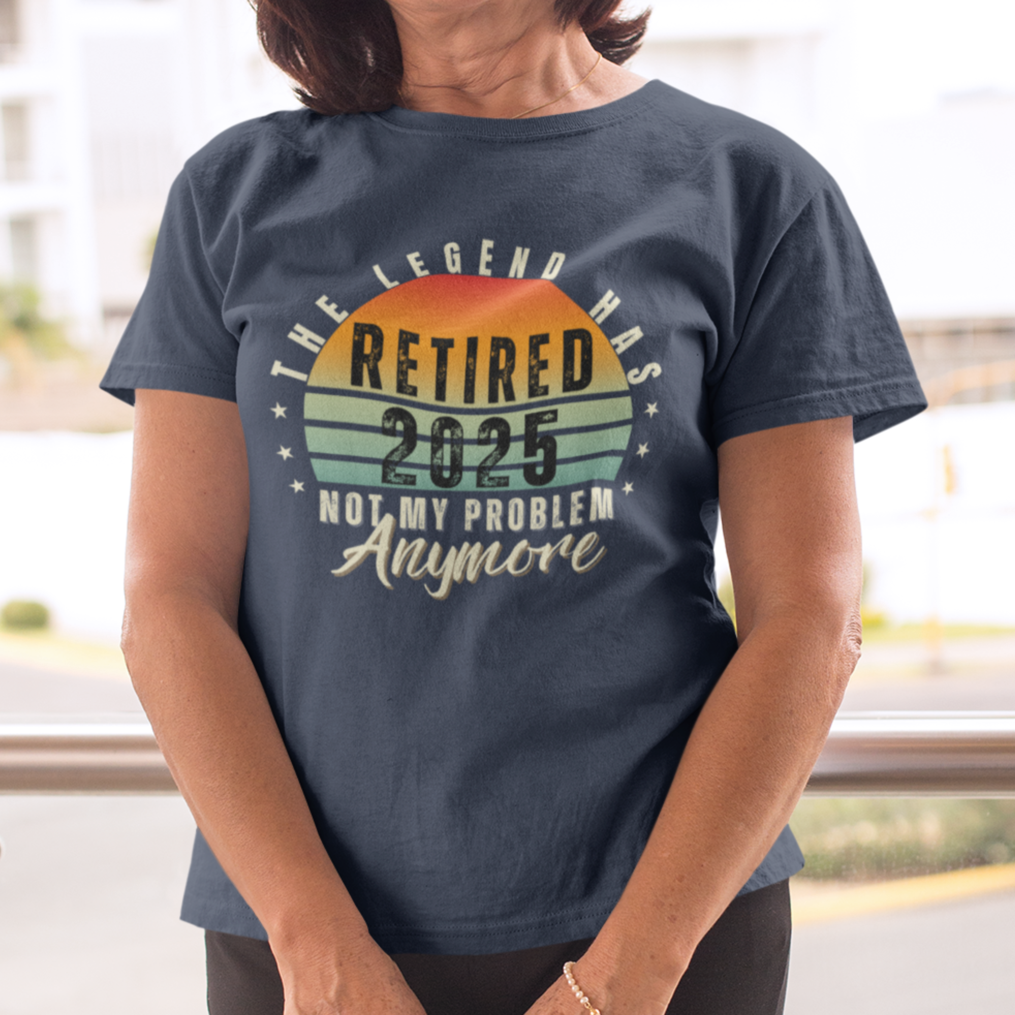Navy blue t-shirt featuring a striped sunset that reads The Legend Has Retired Not My Problem Anymore