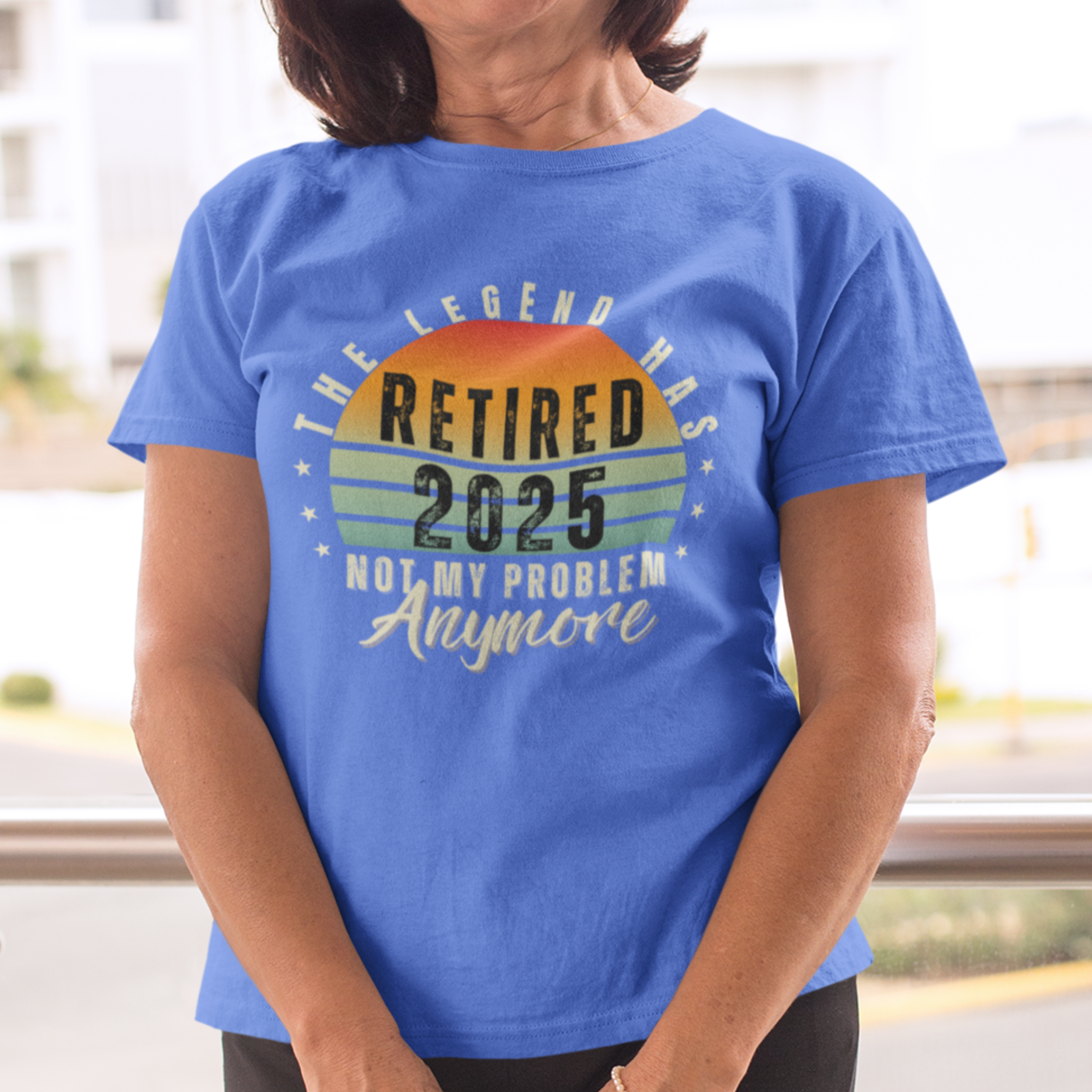 Royal blue t-shirt featuring a striped sunset that reads The Legend Has Retired Not My Problem Anymore