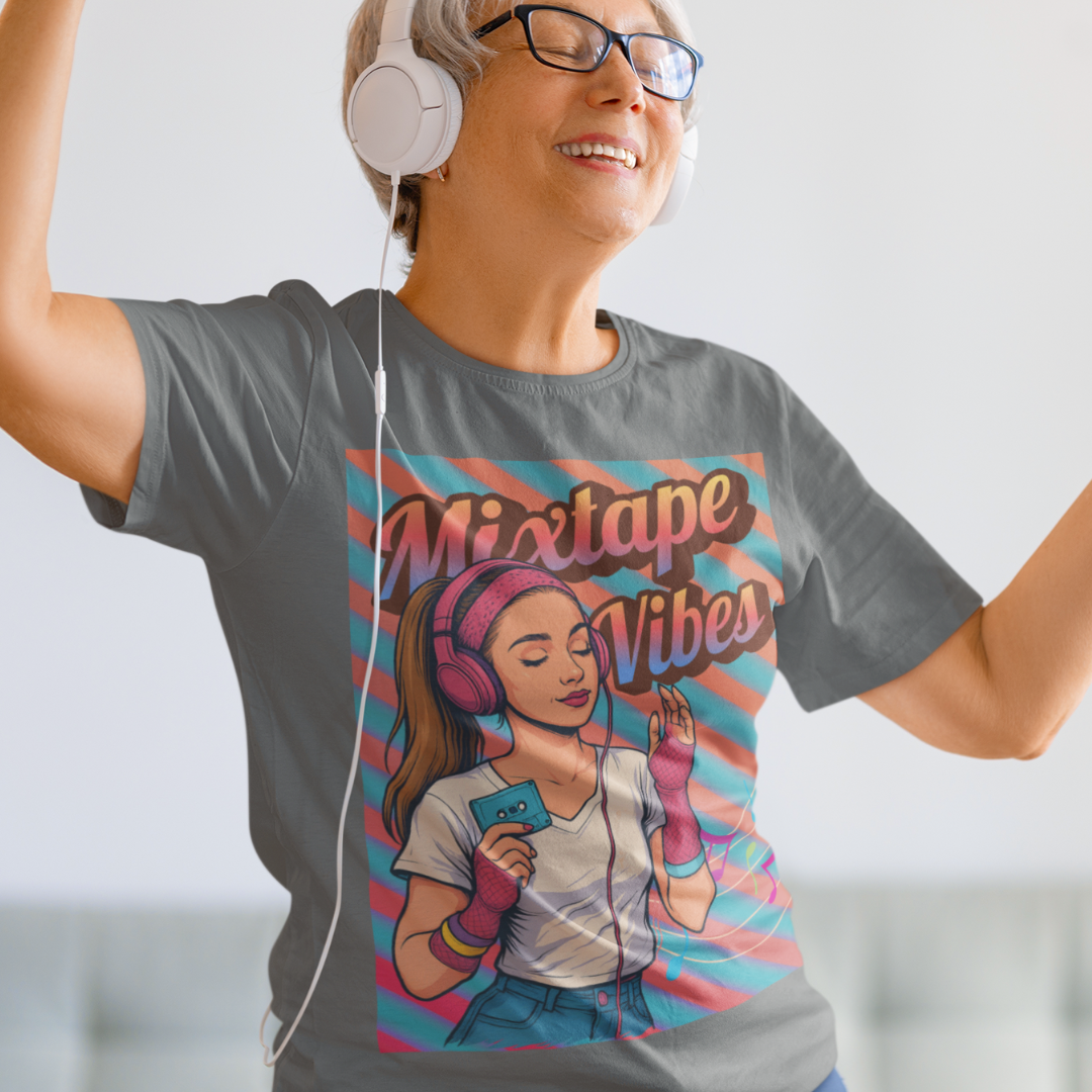 Heather gray tee featuring a teenage girl from the 1980s listening to her cassette player with the pastel colors of that era