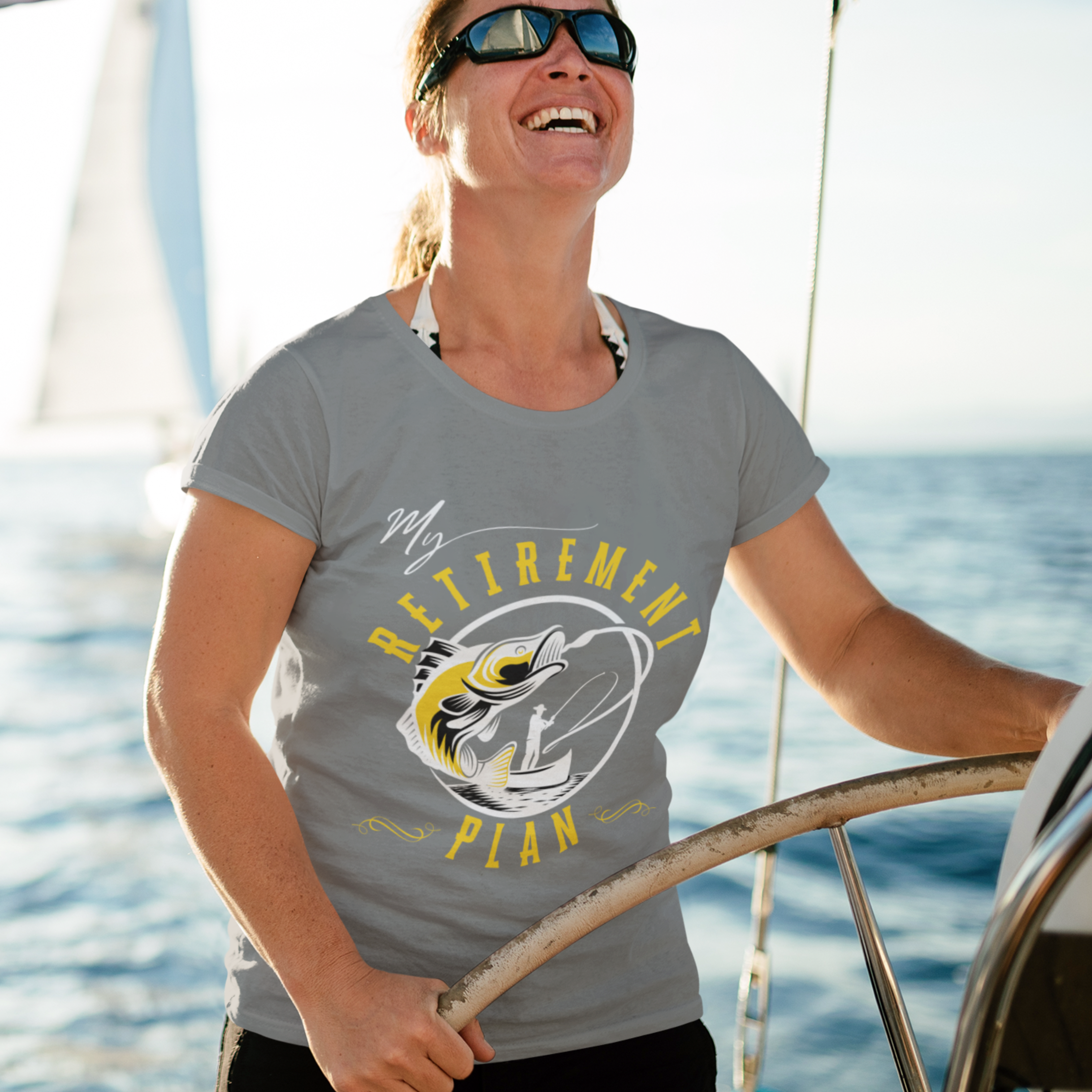 Heather gray t-shirt featuring a fisherman hooking a big bass on a fishing line.
