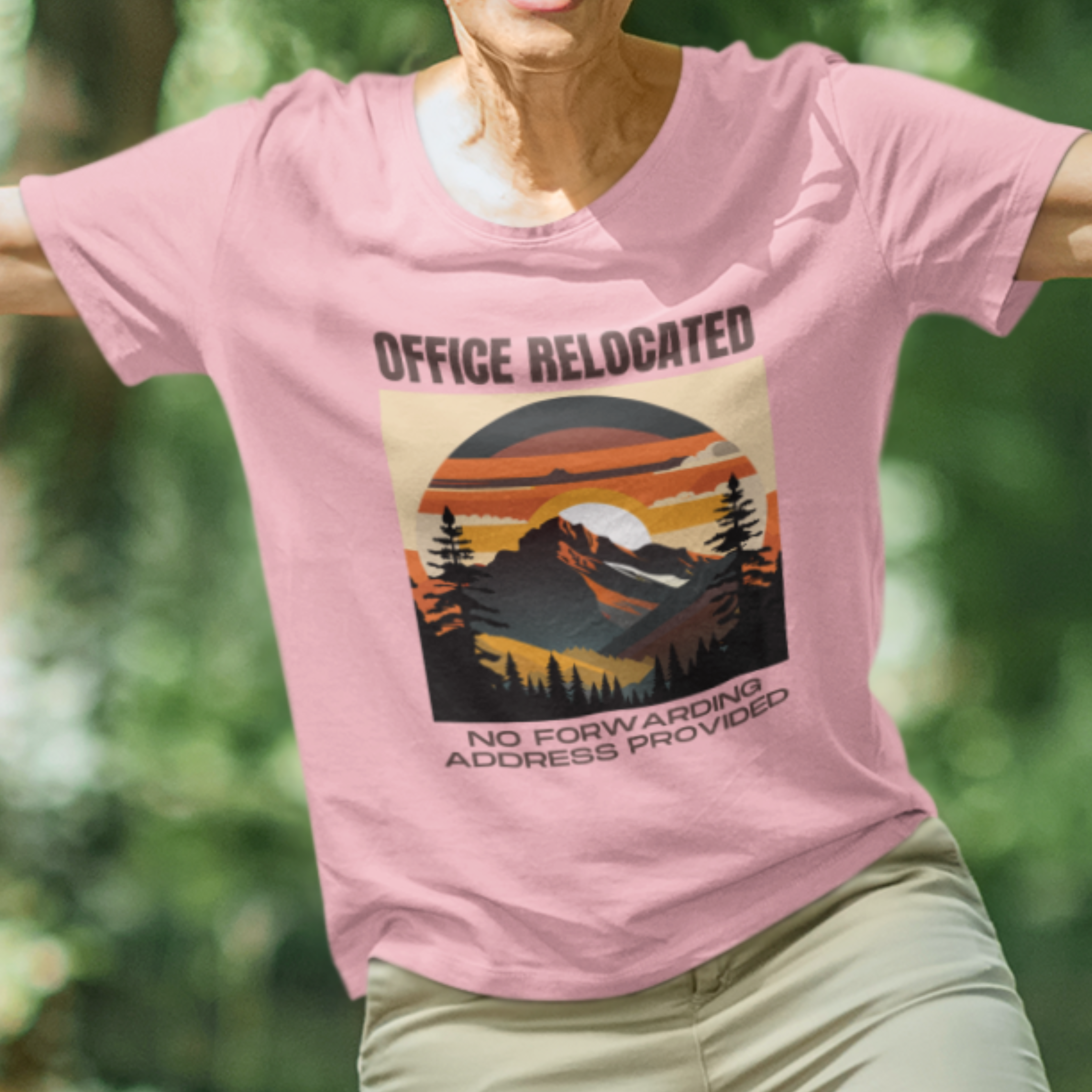 Pink tee featuring a mountain peak at sunset in warm colors that reads Office Relocated No Forwarding Address Provided