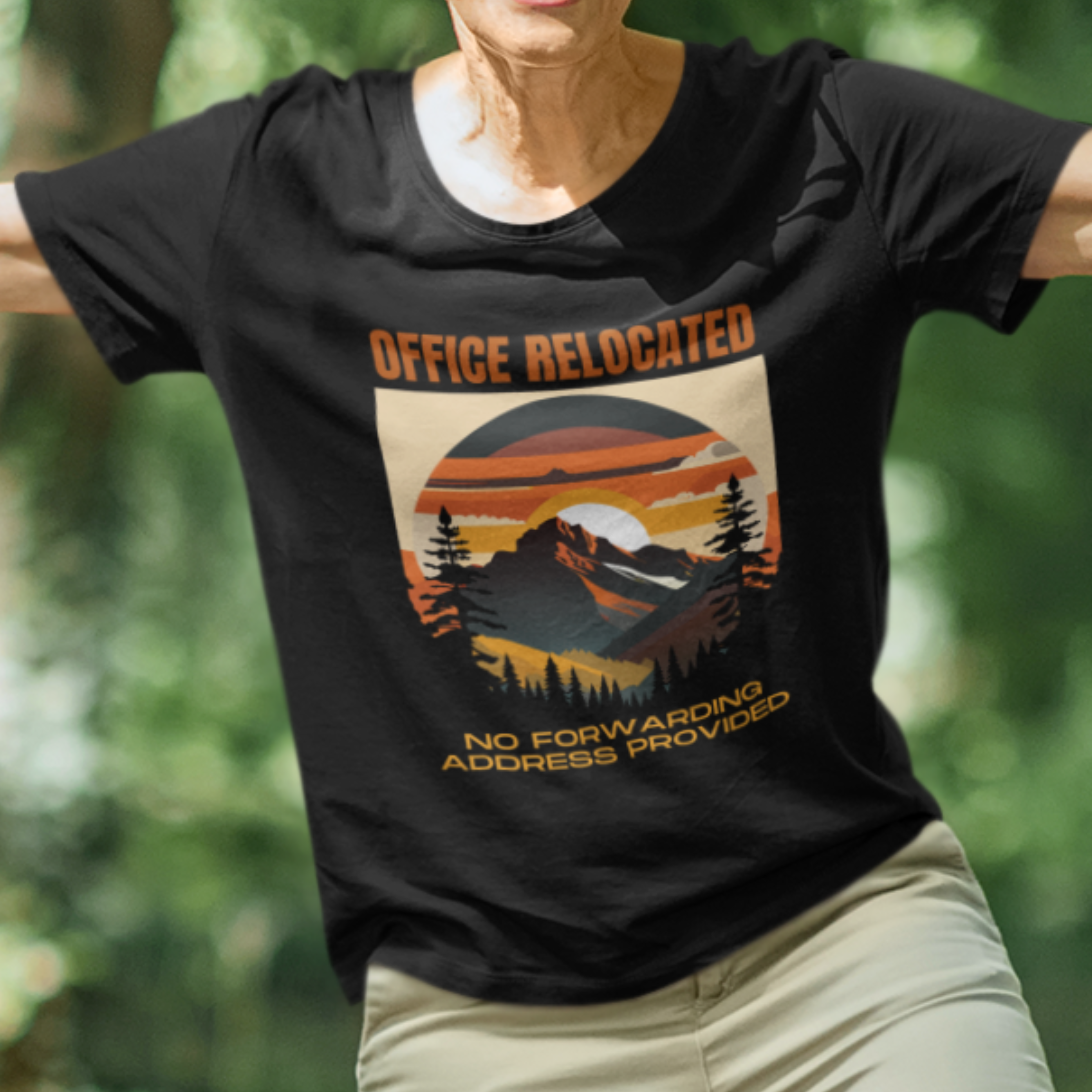 Black tee featuring a mountain peak at sunset in warm colors that reads Office Relocated No Forwarding Address Provided
