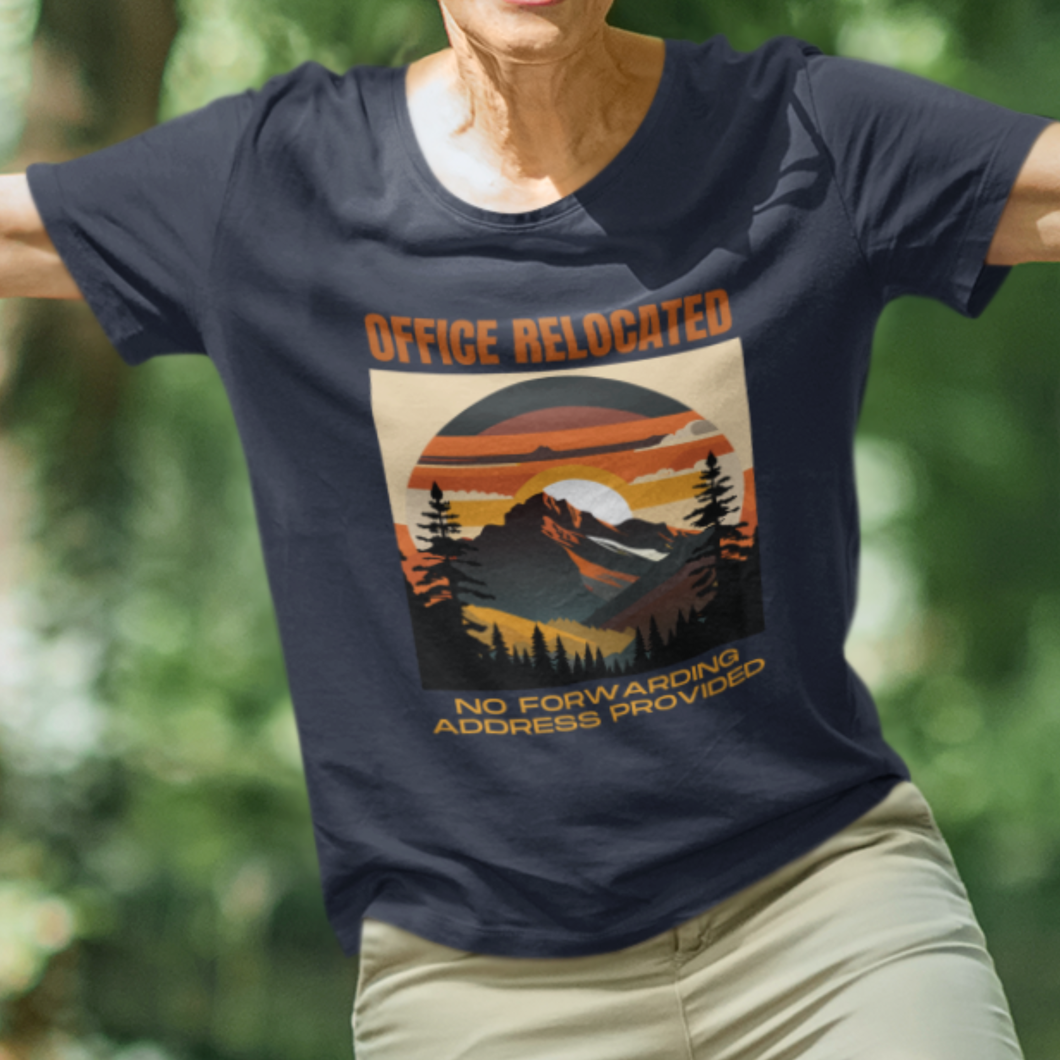 Navy blue tee featuring a mountain peak at sunset in warm colors that reads Office Relocated No Forwarding Address Provided