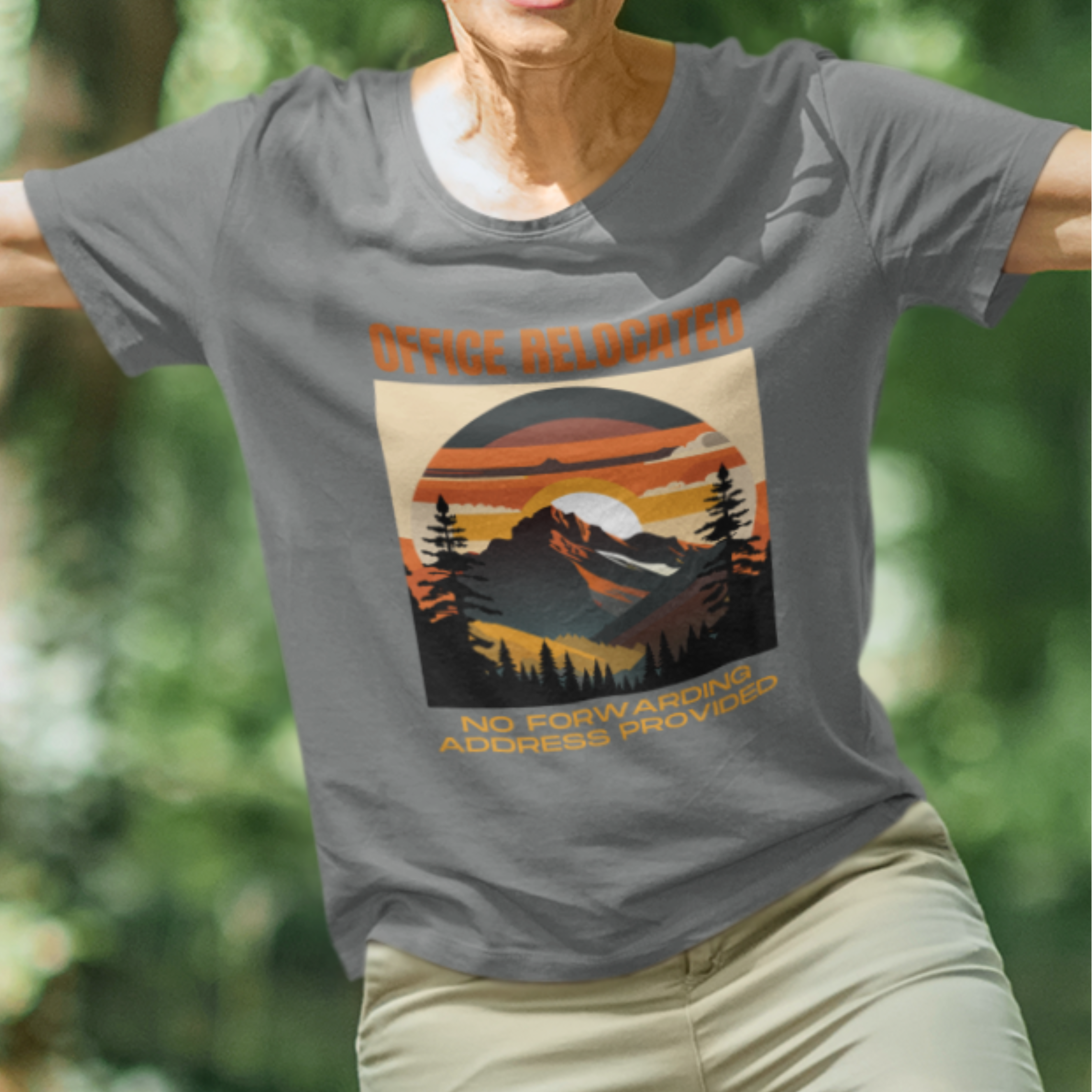 Gray tee featuring a mountain peak at sunset in warm colors that reads Office Relocated No Forwarding Address Provided