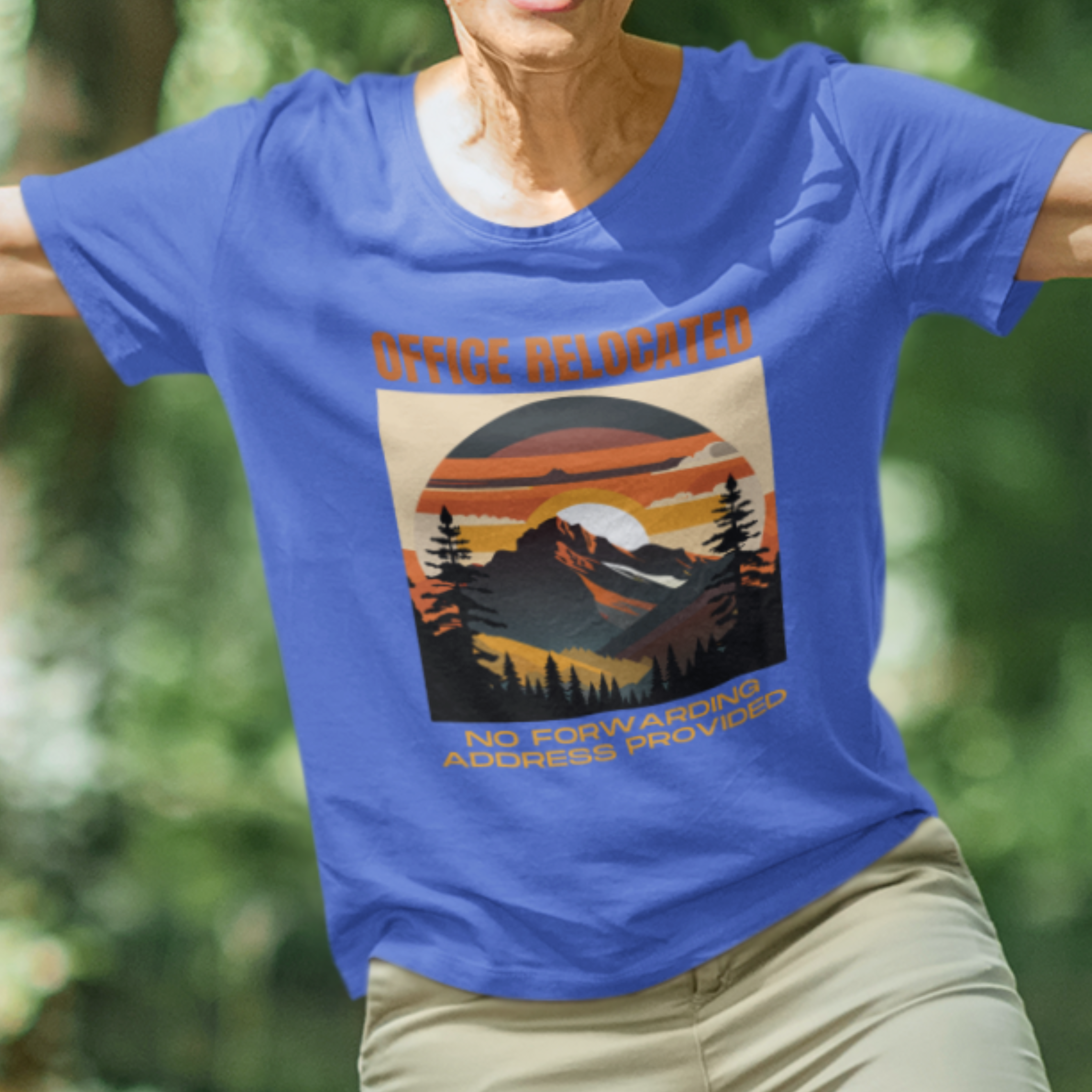 Royal blue tee featuring a mountain peak at sunset in warm colors that reads Office Relocated No Forwarding Address Provided