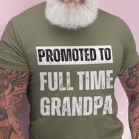 Military green tee featuring bold lettering that reads "Promoted to Full Time Grandpa"