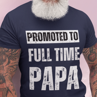 Navy blue tee featuring bold lettering that reads "Promoted to Full Time Papa"