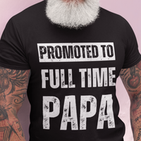 Black tee featuring bold lettering that reads "Promoted to Full Time Papa"