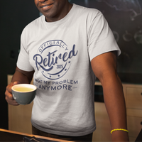 White tee featuring a replica of an official stamp embossing that reads "Officially Retired 2025 Not My Problem Anymore"
