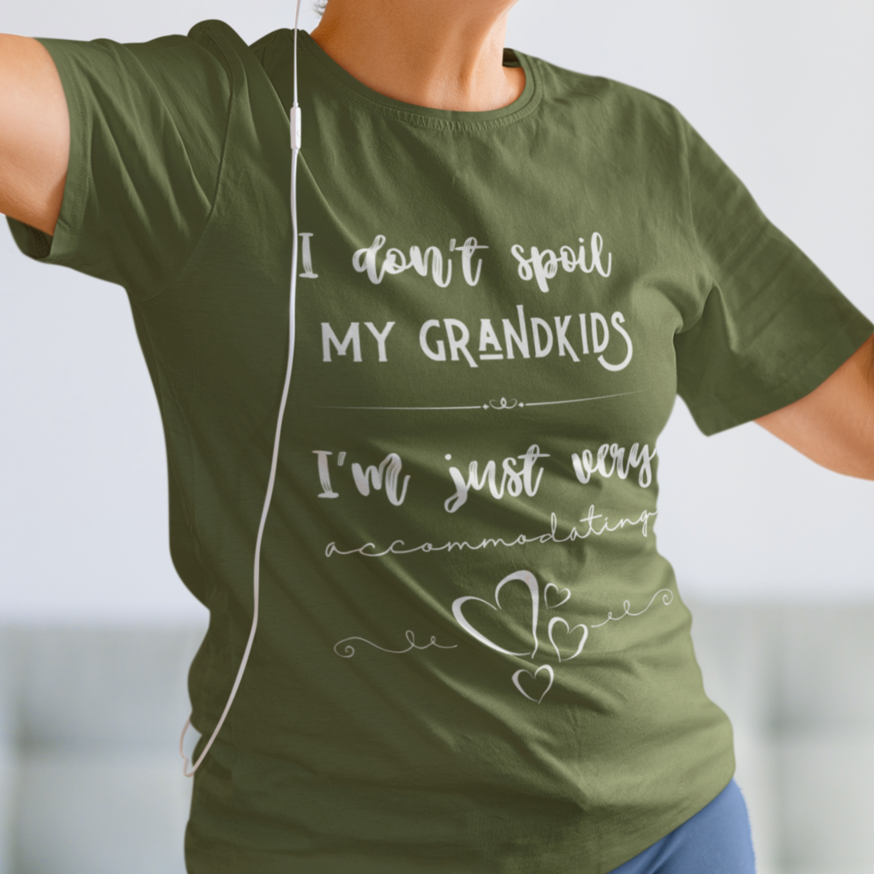 Military green tee that reads I Don't Spoil My Grandkids, I'm Just Very Accommodating with heart shapes