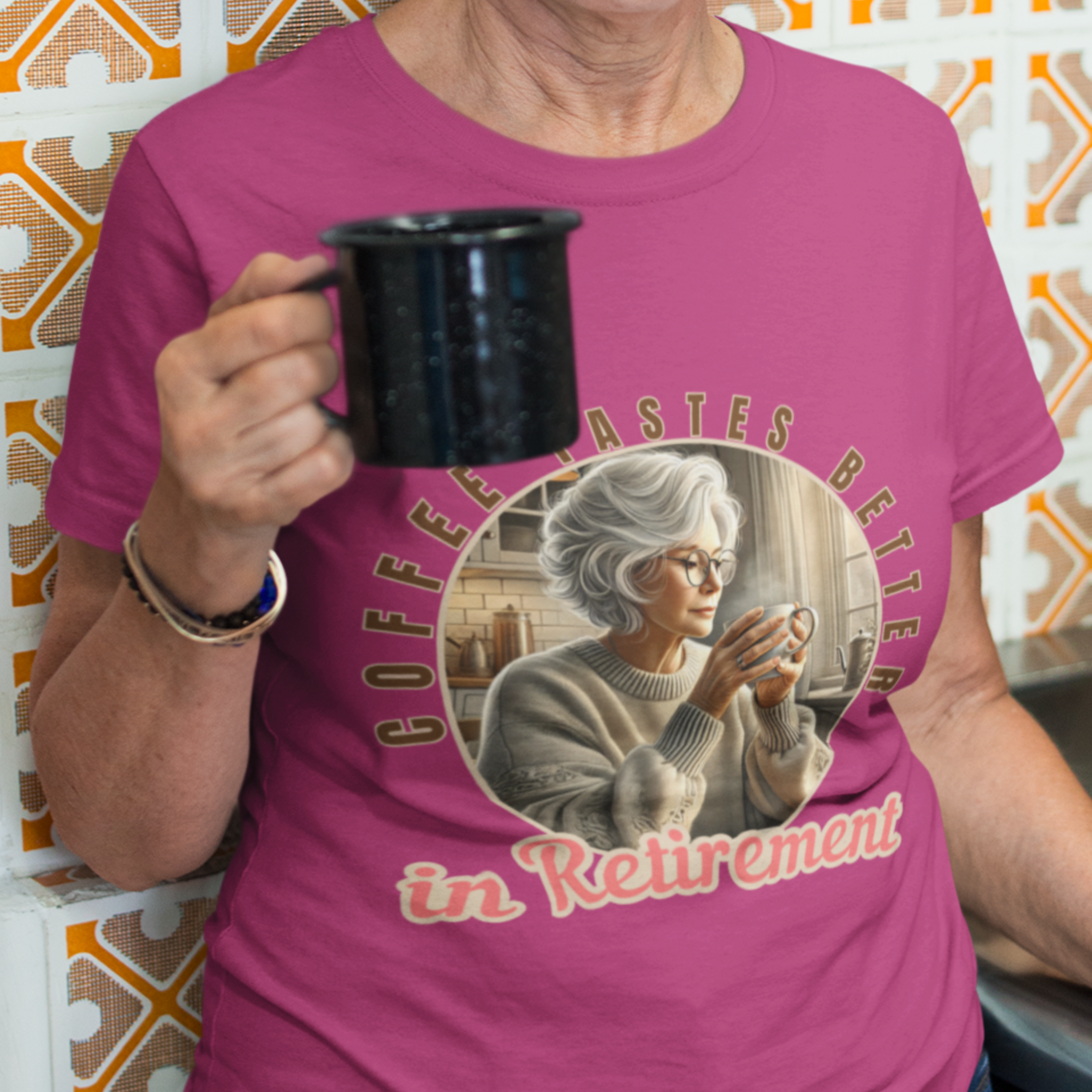 Dark pink (Antique Heliconia)i tee featuring a senior woman at her kitchen table enjoying a hot cup of coffee.