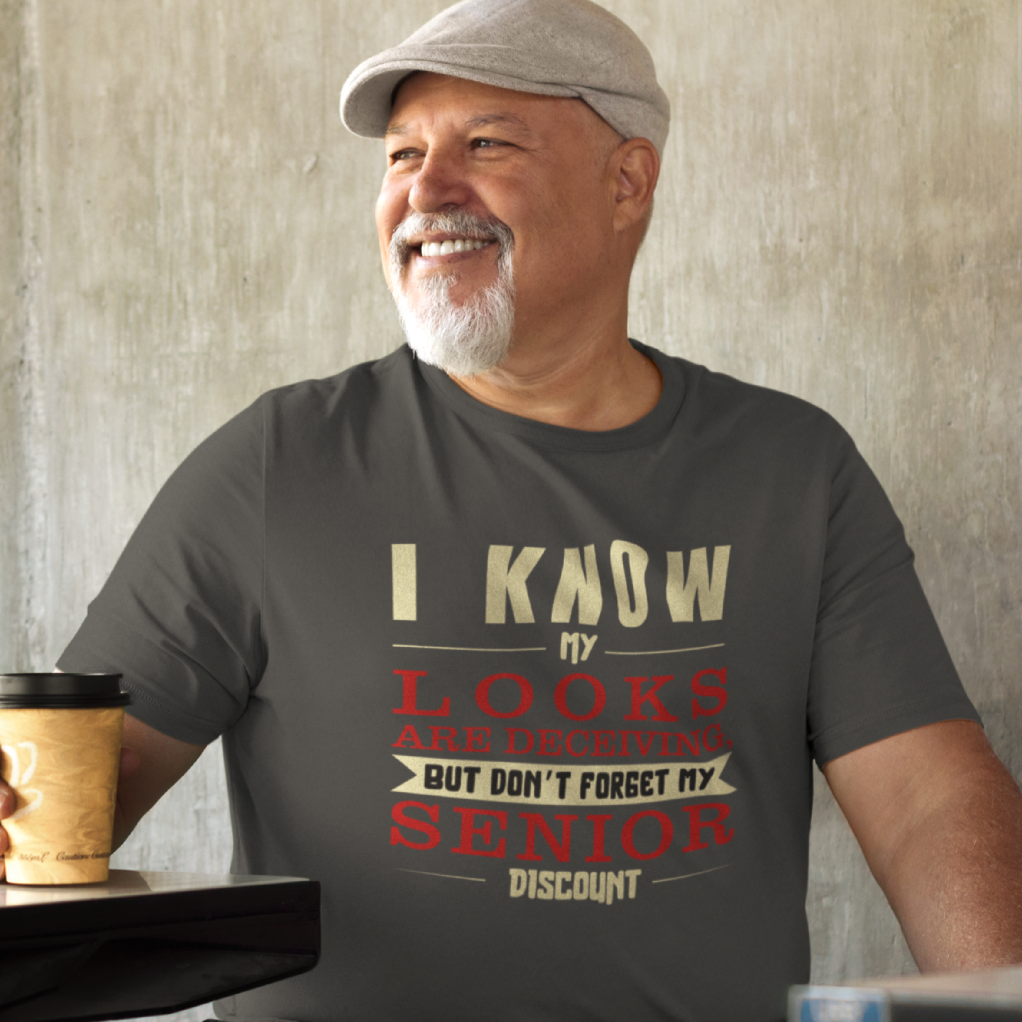 Heather gray t-shirt in bold, colorful lettering of alternating sizes about that senior discount.  
