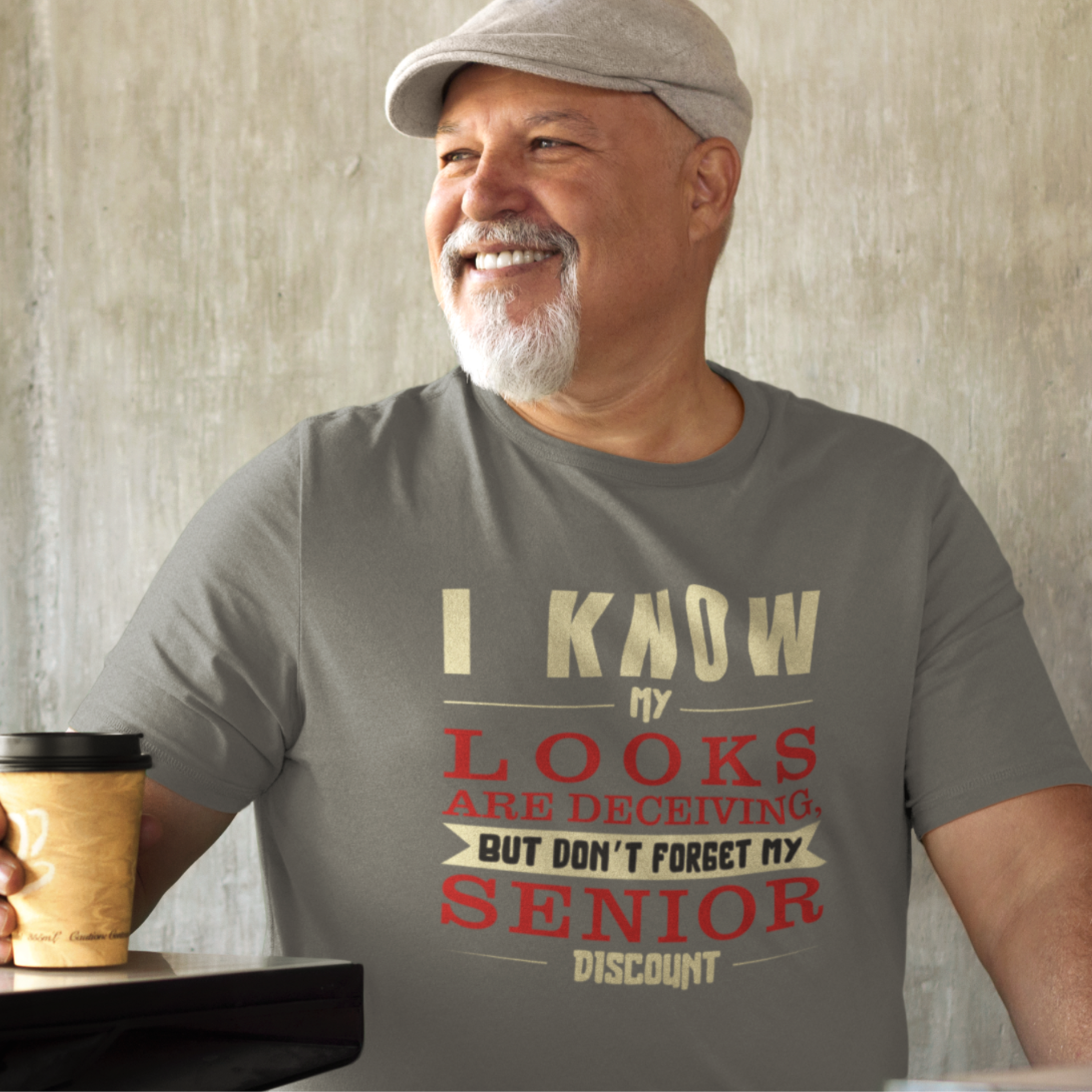 Heather gray t-shirt in bold, colorful lettering of alternating sizes about that senior discount.  