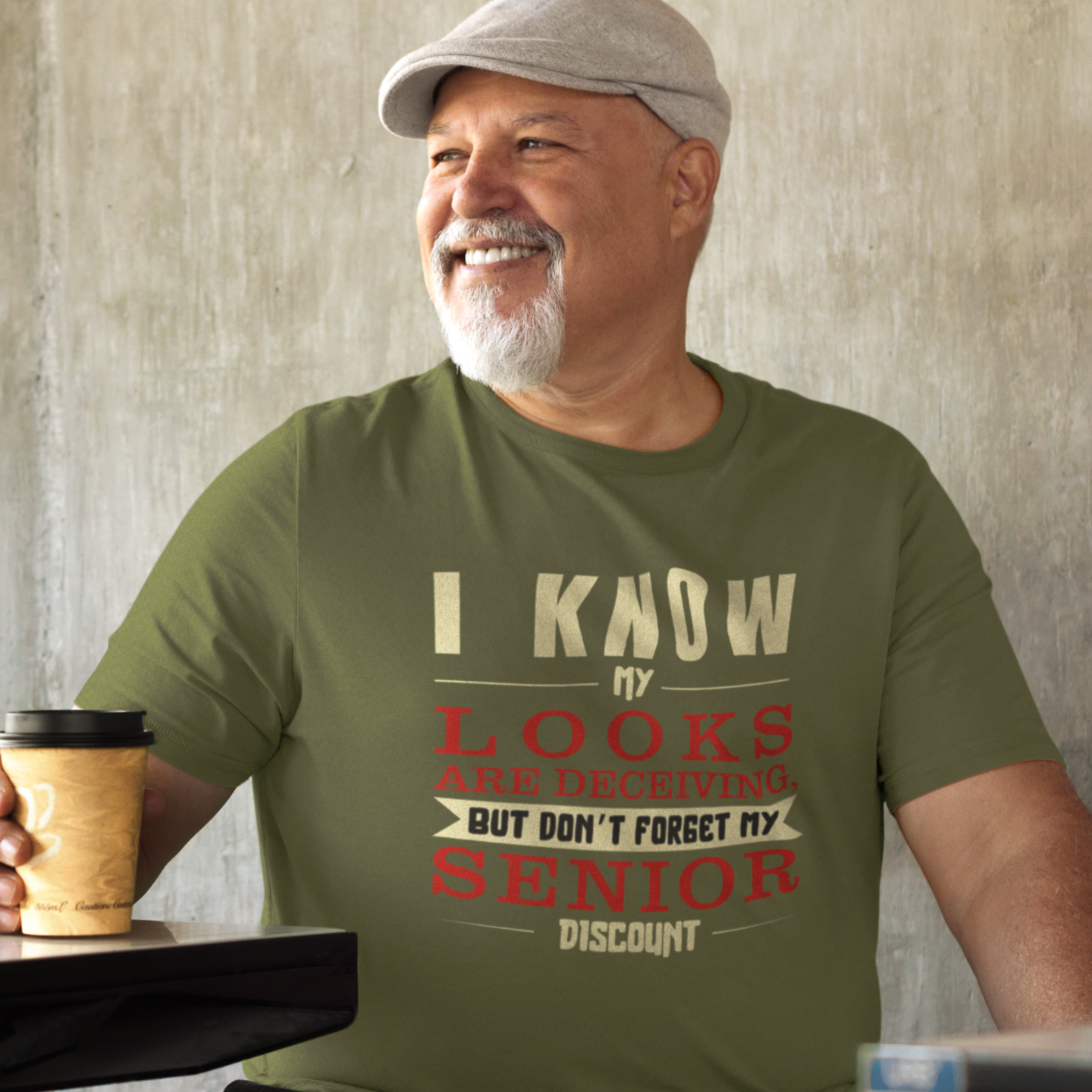 Military green t-shirt in bold, colorful lettering of alternating sizes about that senior discount.  