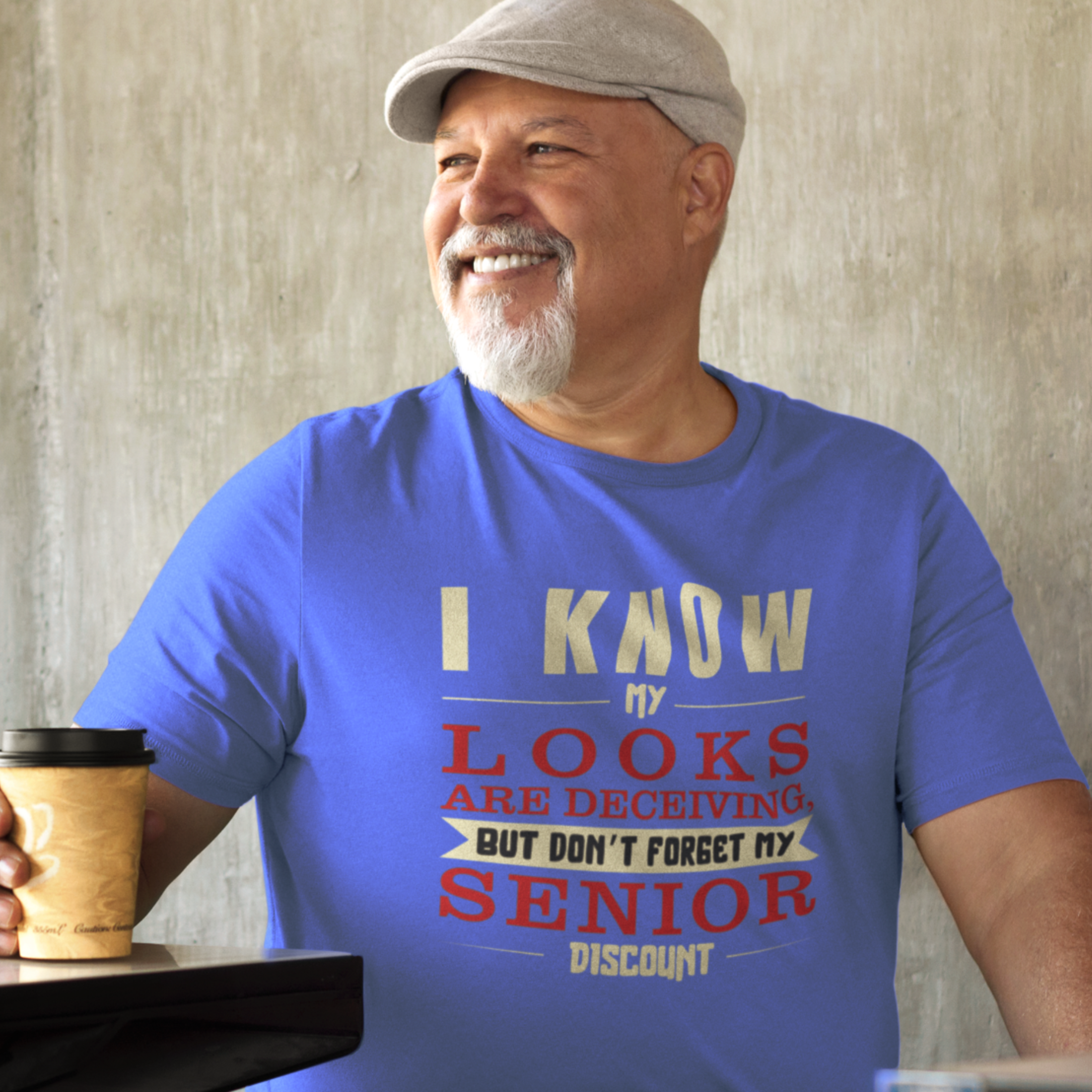 Royal blue t-shirt in bold, colorful lettering of alternating sizes about that senior discount.  