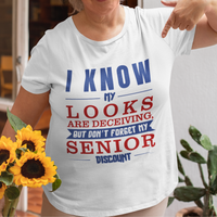 White t-shirt in bold, colorful lettering of alternating sizes about that senior discount.  