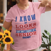Light Pink t-shirt in bold, colorful lettering of alternating sizes about that senior discount.  