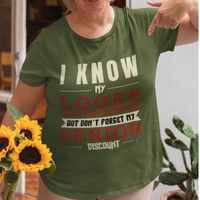 Military green t-shirt in bold, colorful lettering of alternating sizes about that senior discount.  