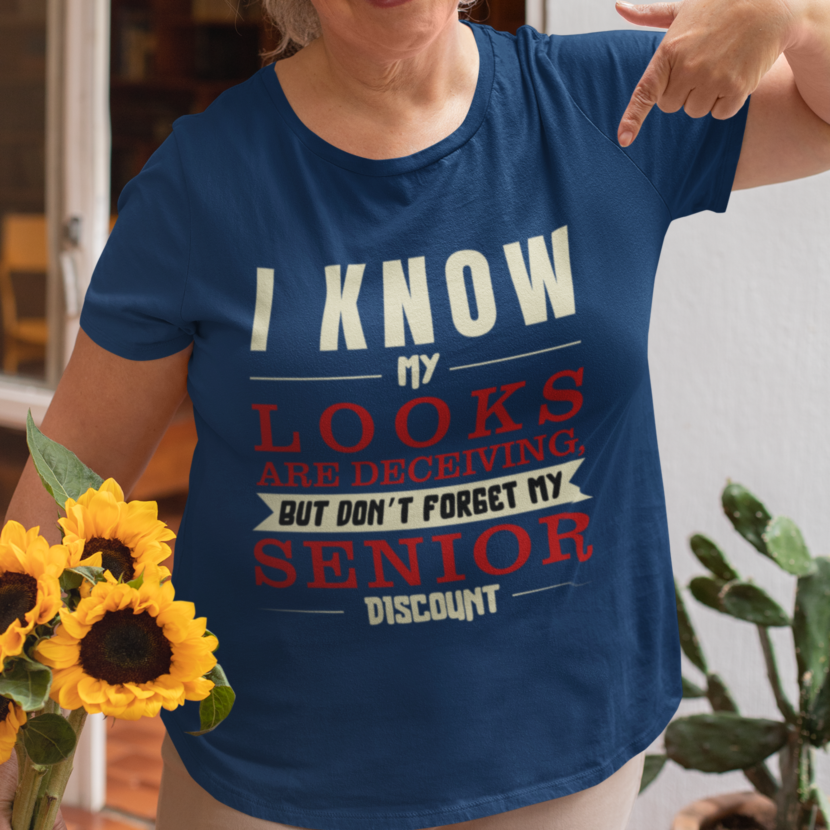 Navy blue t-shirt in bold, colorful lettering of alternating sizes about that senior discount.  