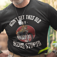 Black t-shirt featuring a mean-looking cartoon grizzly on the back of a motorcycle blowing flames out the pipes.