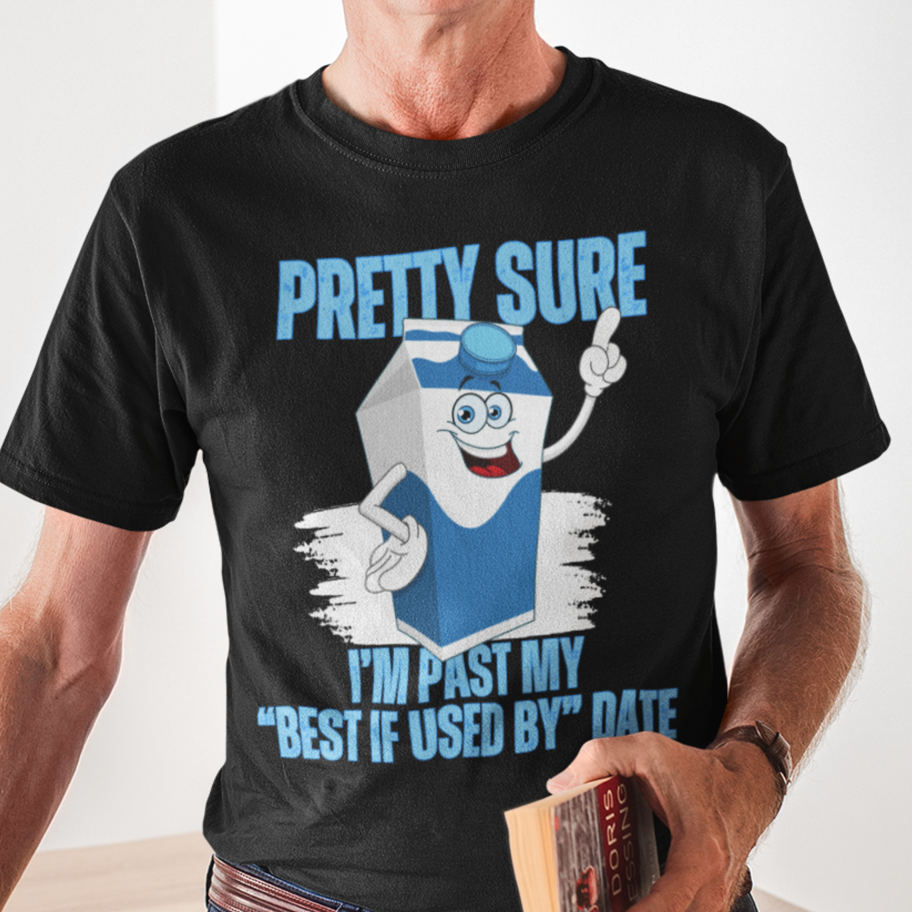 Black t-shirt with neon lettering, featuring a cartoon carton of milk. 