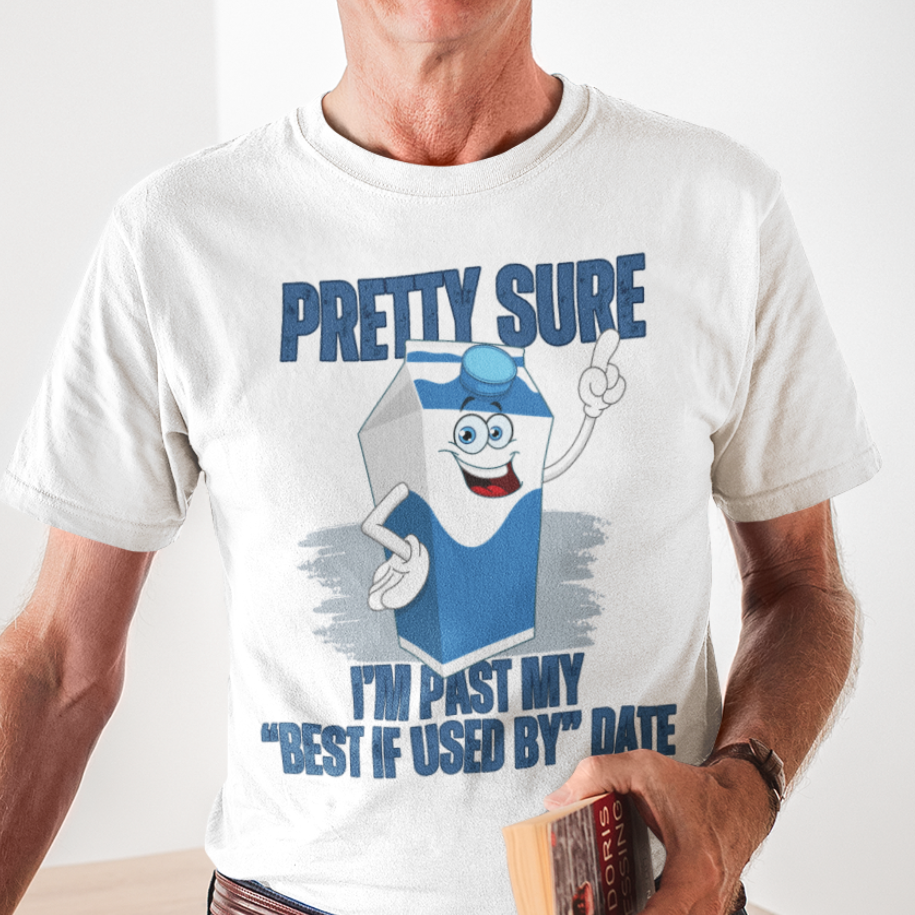 White t-shirt with neon lettering, featuring a cartoon carton of milk. 
