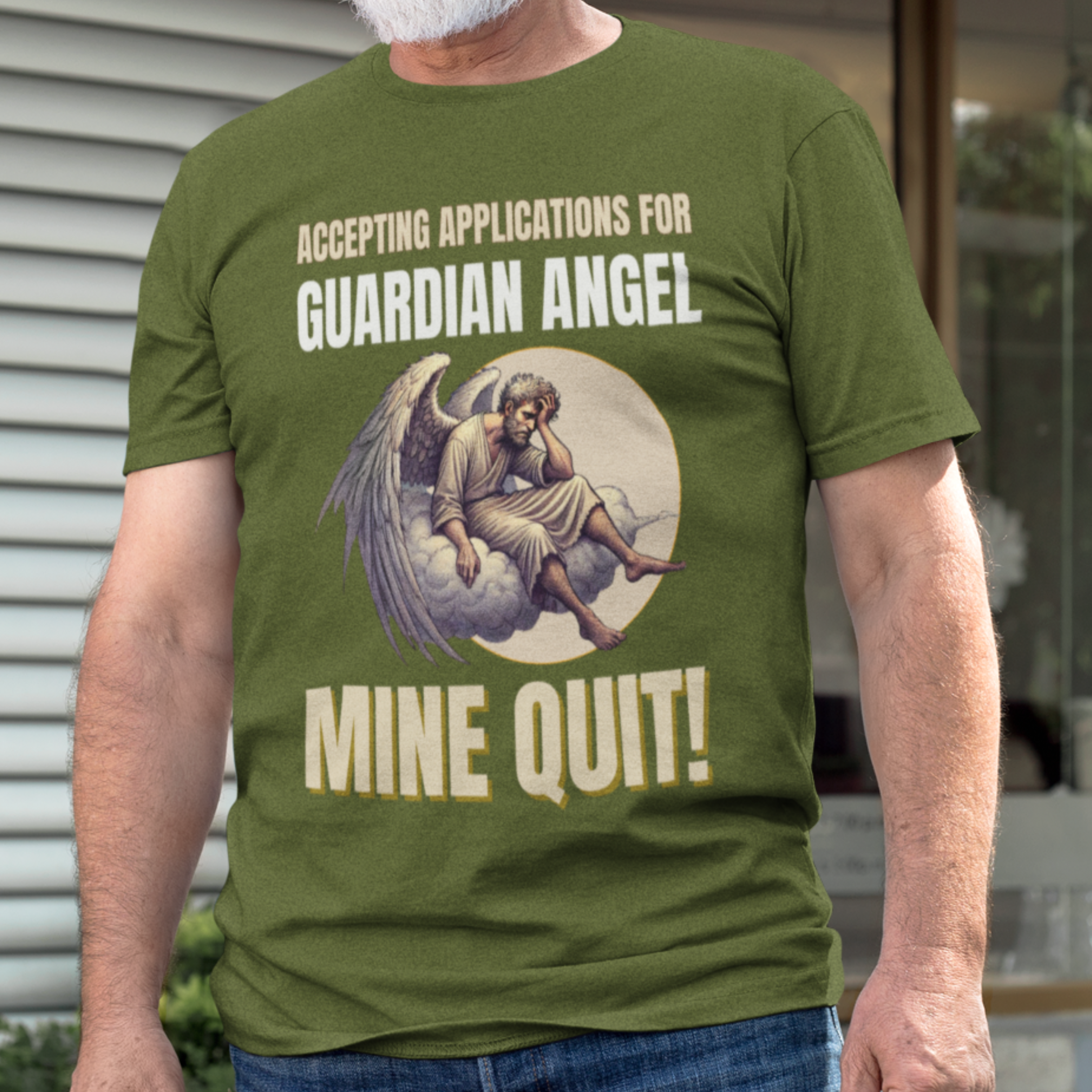 Military green t-shirt featuring a weary angel perched on a cloud with his head in his hand
