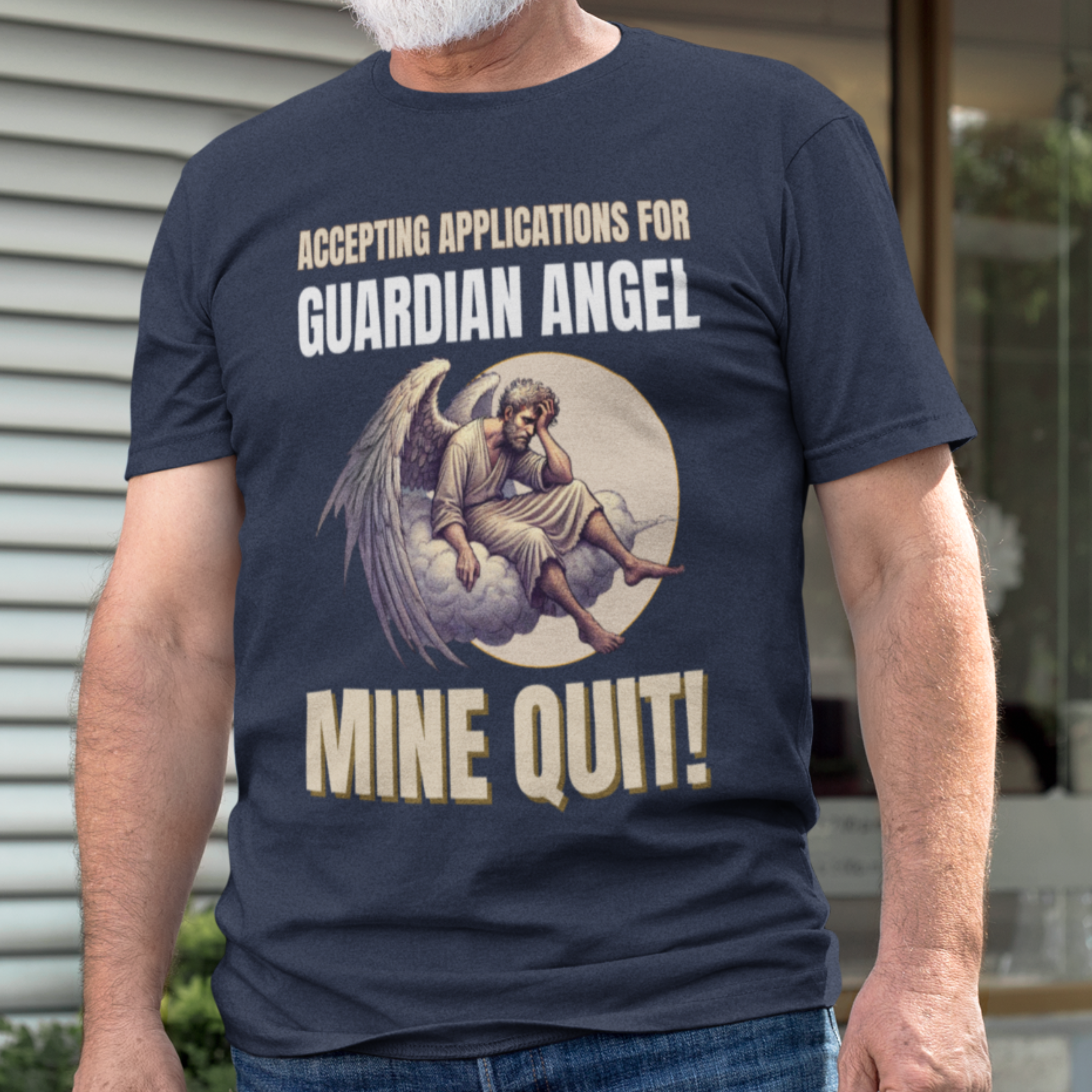 Navy blue t-shirt featuring a weary angel perched on a cloud with his head in his hand