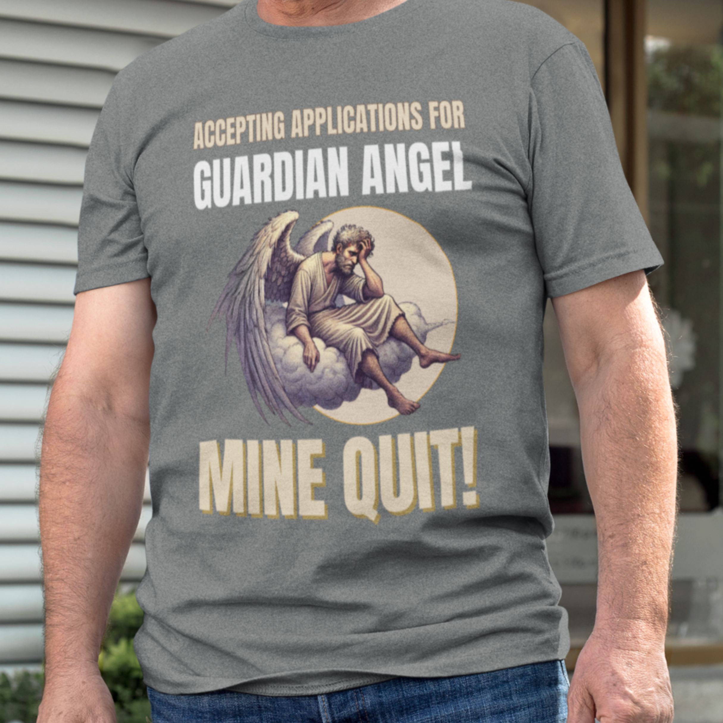 Heather gray t-shirt featuring a weary angel perched on a cloud with his head in his hand