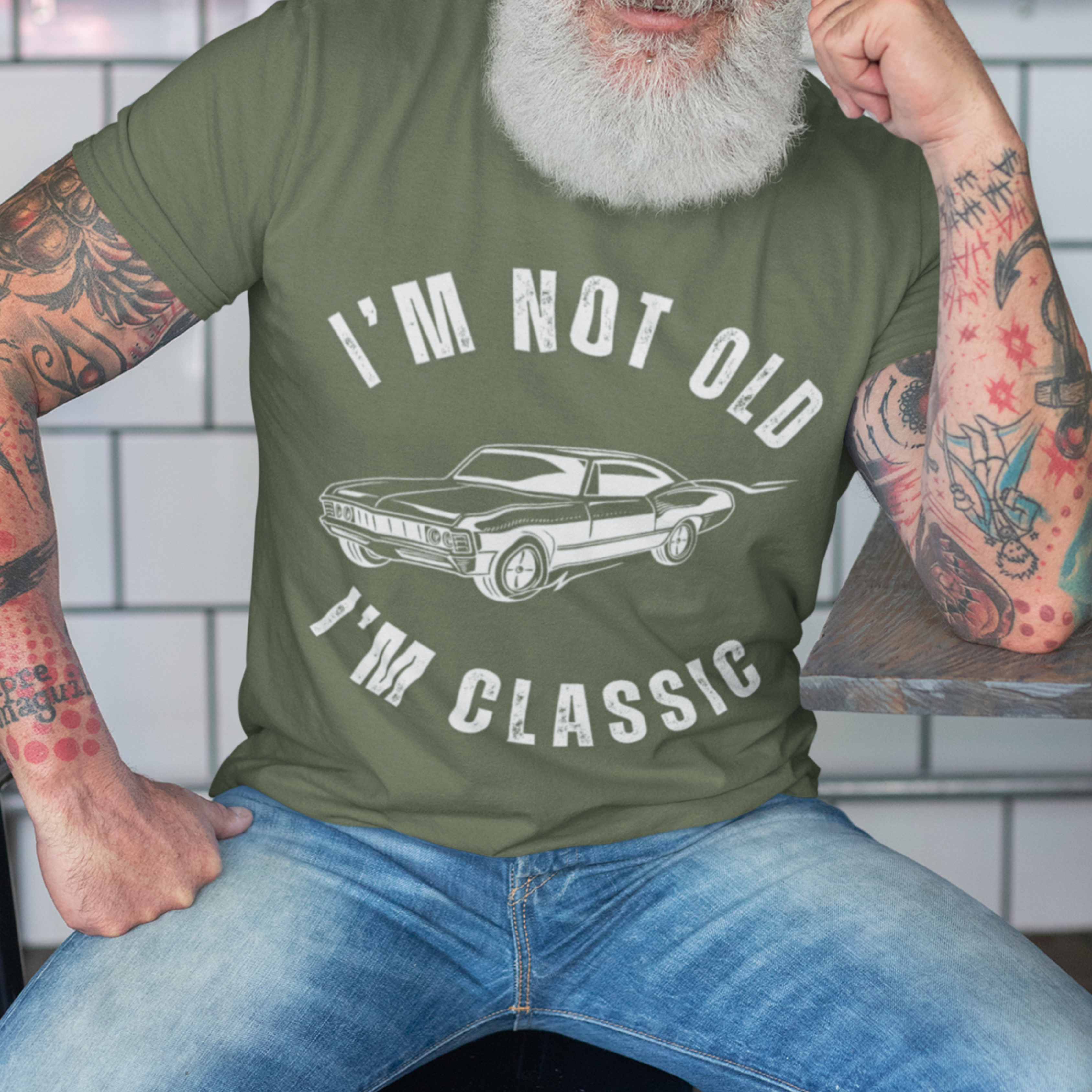Military green tee featuring contour drawing of a 70s style muscle car 