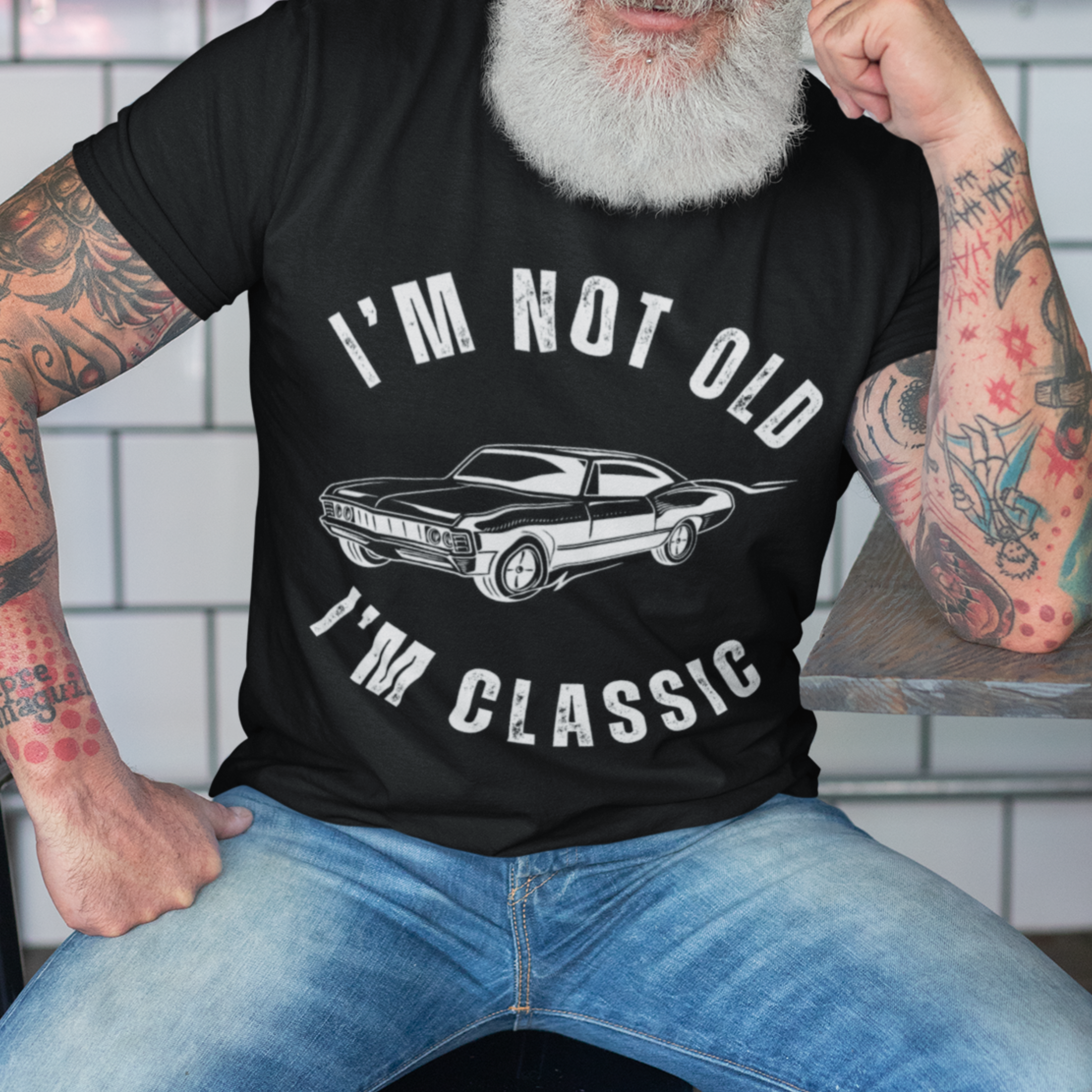 Black tee featuring contour drawing of a 70s style muscle car 