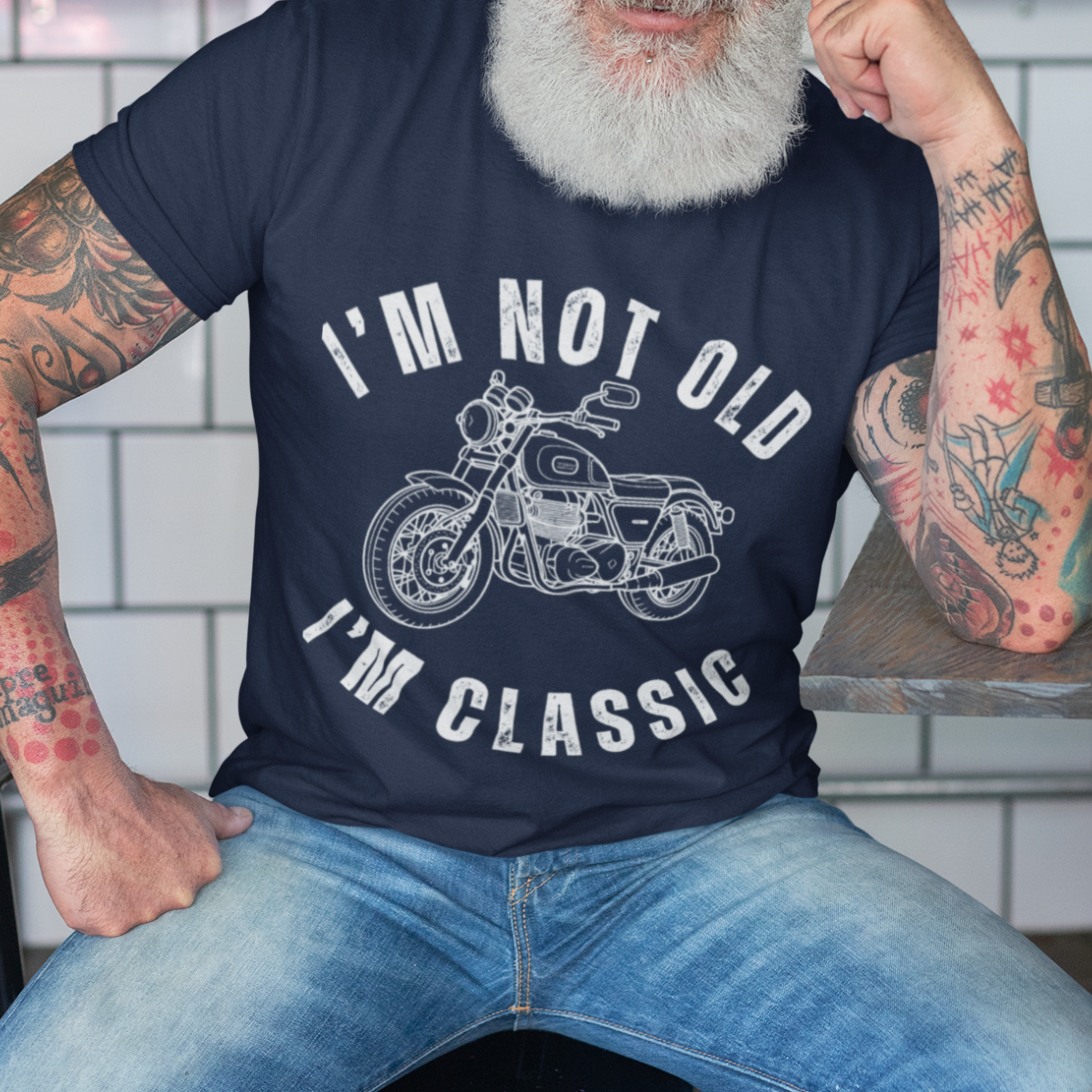 Navy blue tee featuring contour drawing of a classic motorcycle