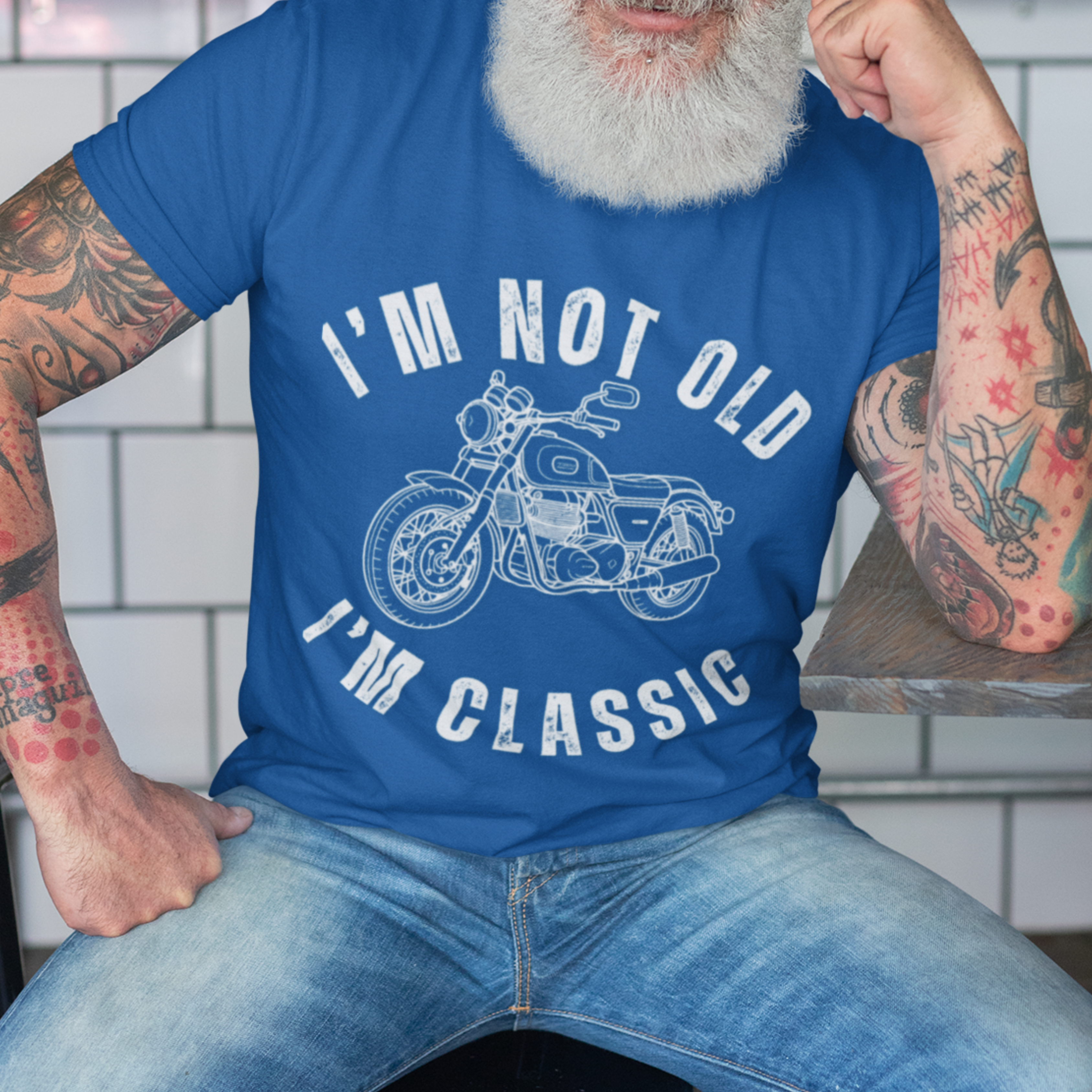 Royal blue tee featuring contour drawing of a classic motorcycle