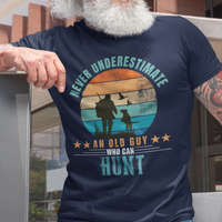 Navy blue tee featuring silhouette of a hunter with a shotgun and his trusty dog cast against a stylish distressed striped sunset 