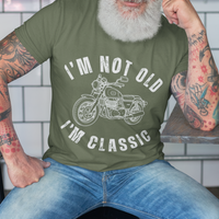 Military green tee featuring contour drawing of a classic motorcycle