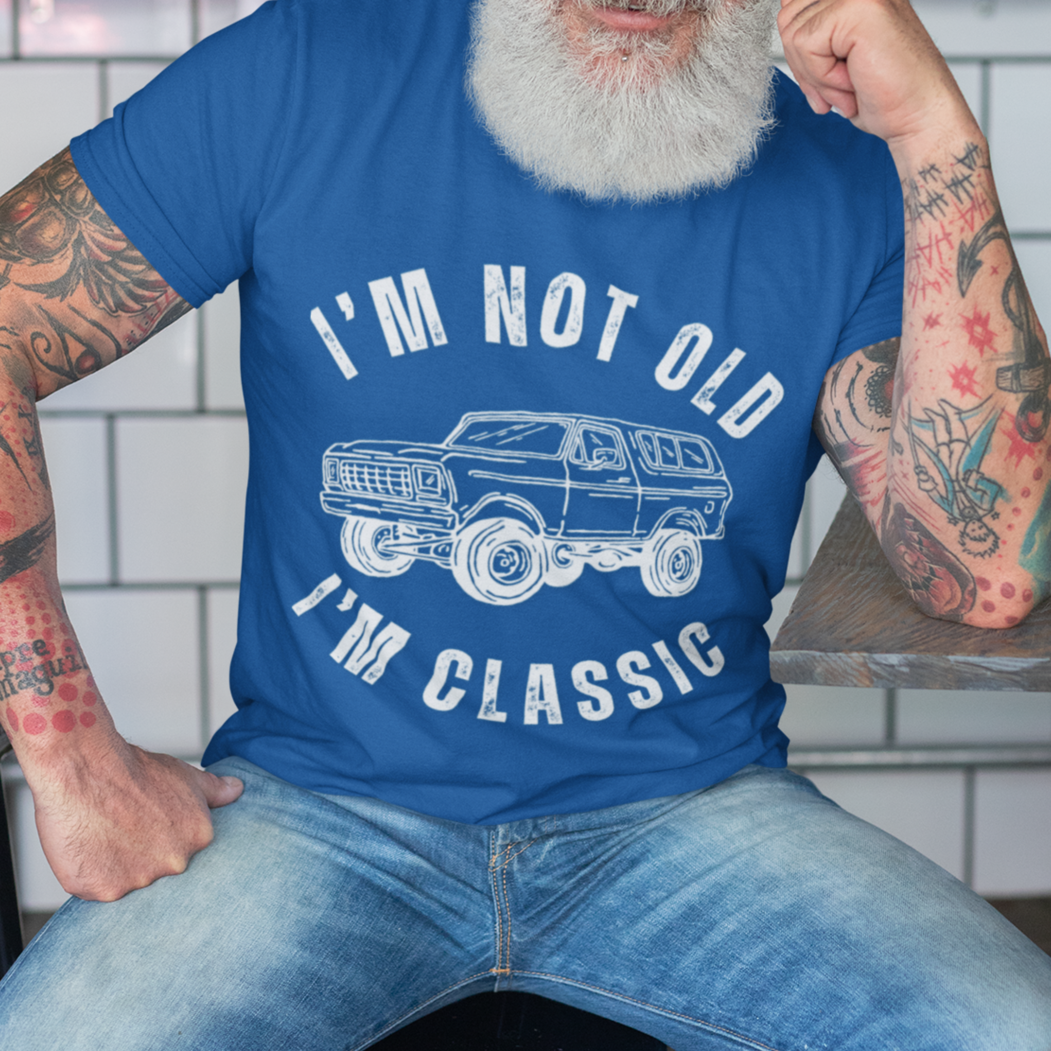 Royal blue tee featuring contour drawing similar in style to the classic GMC Blazer from late twentieth century 
