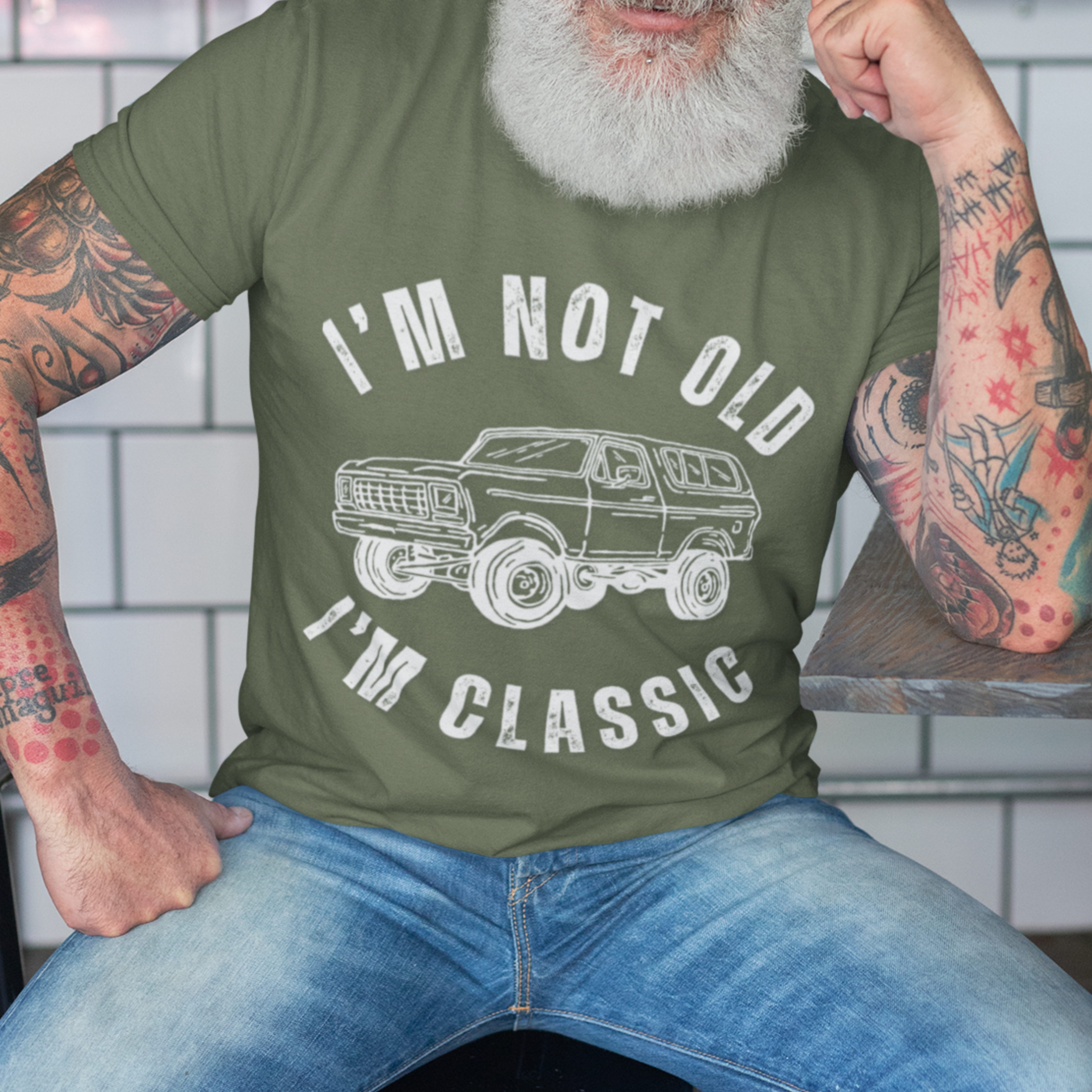 Military green tee featuring contour drawing similar in style to the classic GMC Blazer from late twentieth century 
