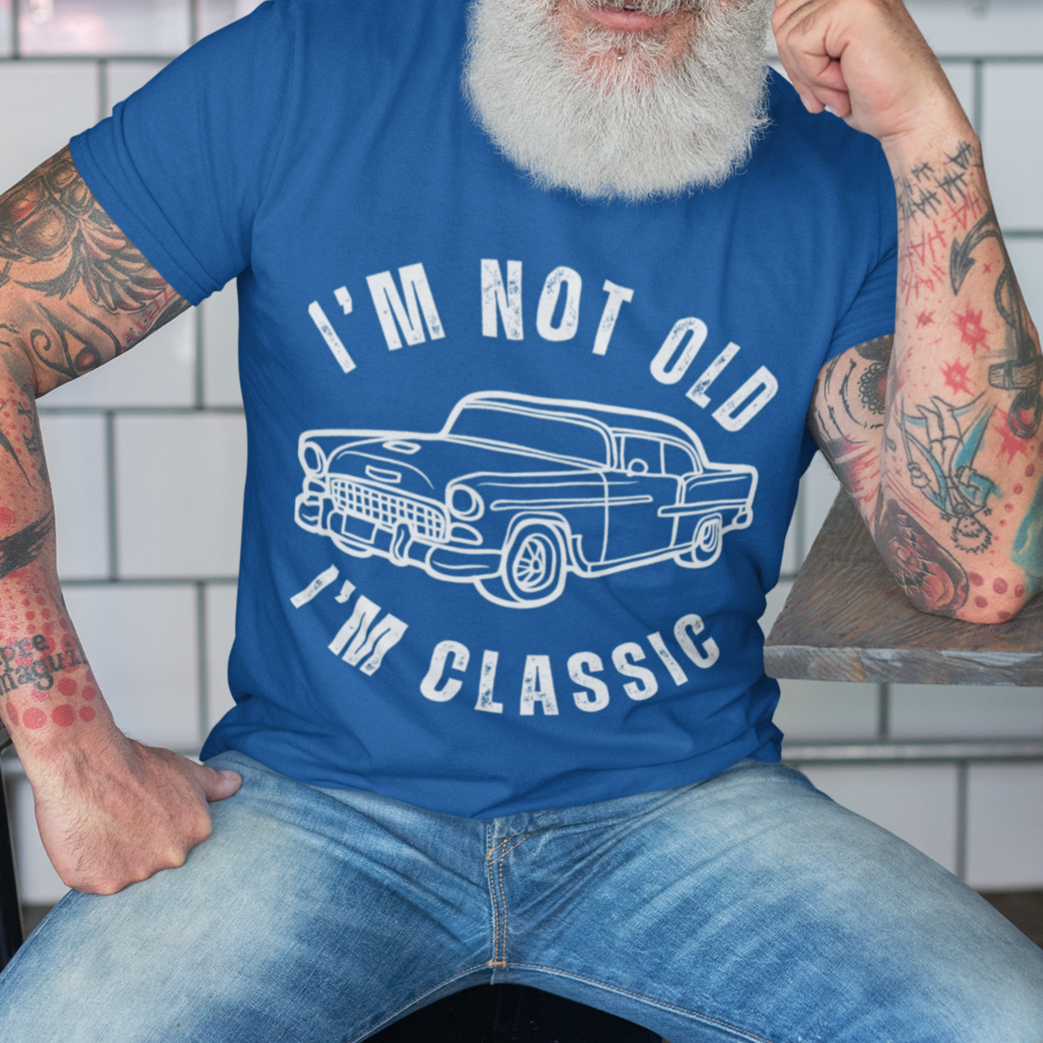 Royal blue tee featuring contour drawing of a popular 50s style automobile 