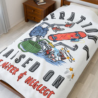 60X80 blanket with colorful graphics and text on a bed in a room.