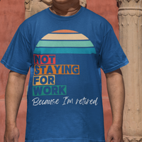 Royal blue tee in multi-color block lettering and rainbow sun reads Not Staying for Work I'm Retired